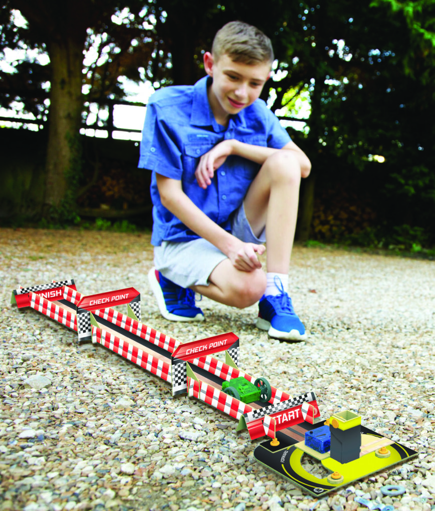 Child playing with finished product from our 4M TechCraft Paper Circuit Racer